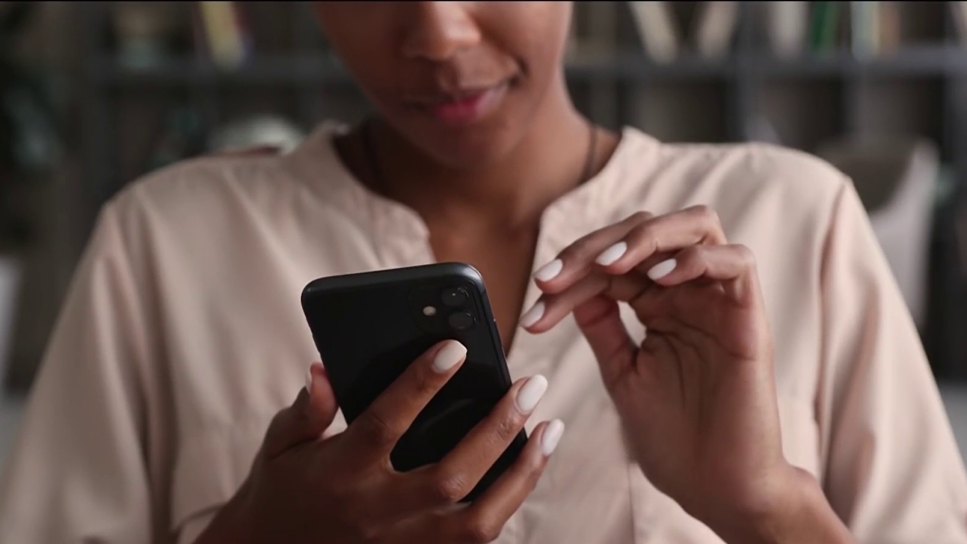 a woman uses her smartphone