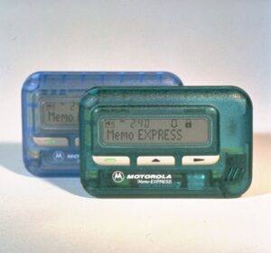 Two Beepers from the '90s, one green and one blue